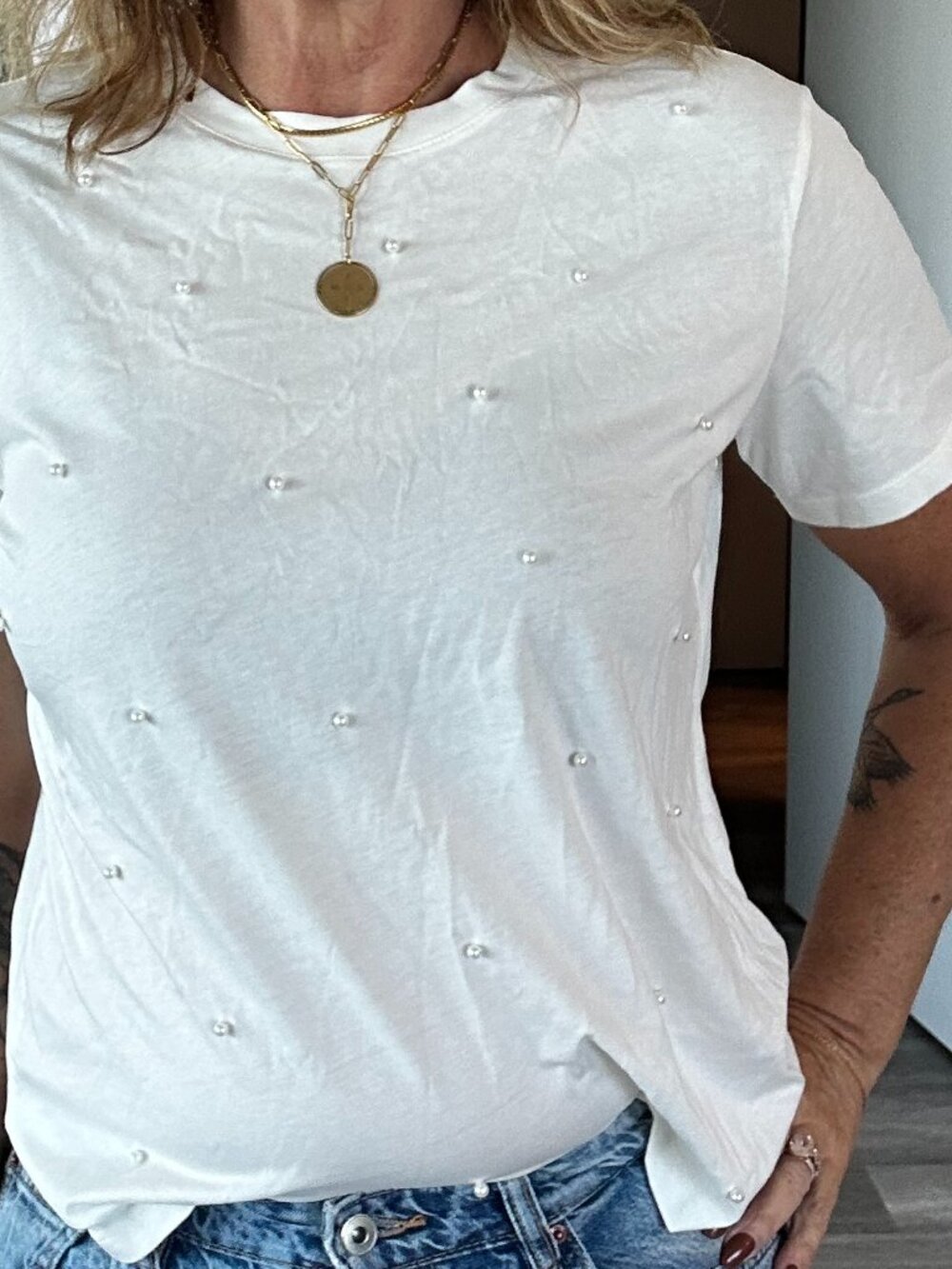 Free with any purchase: White pearl-embelished t-shirt, women's size small